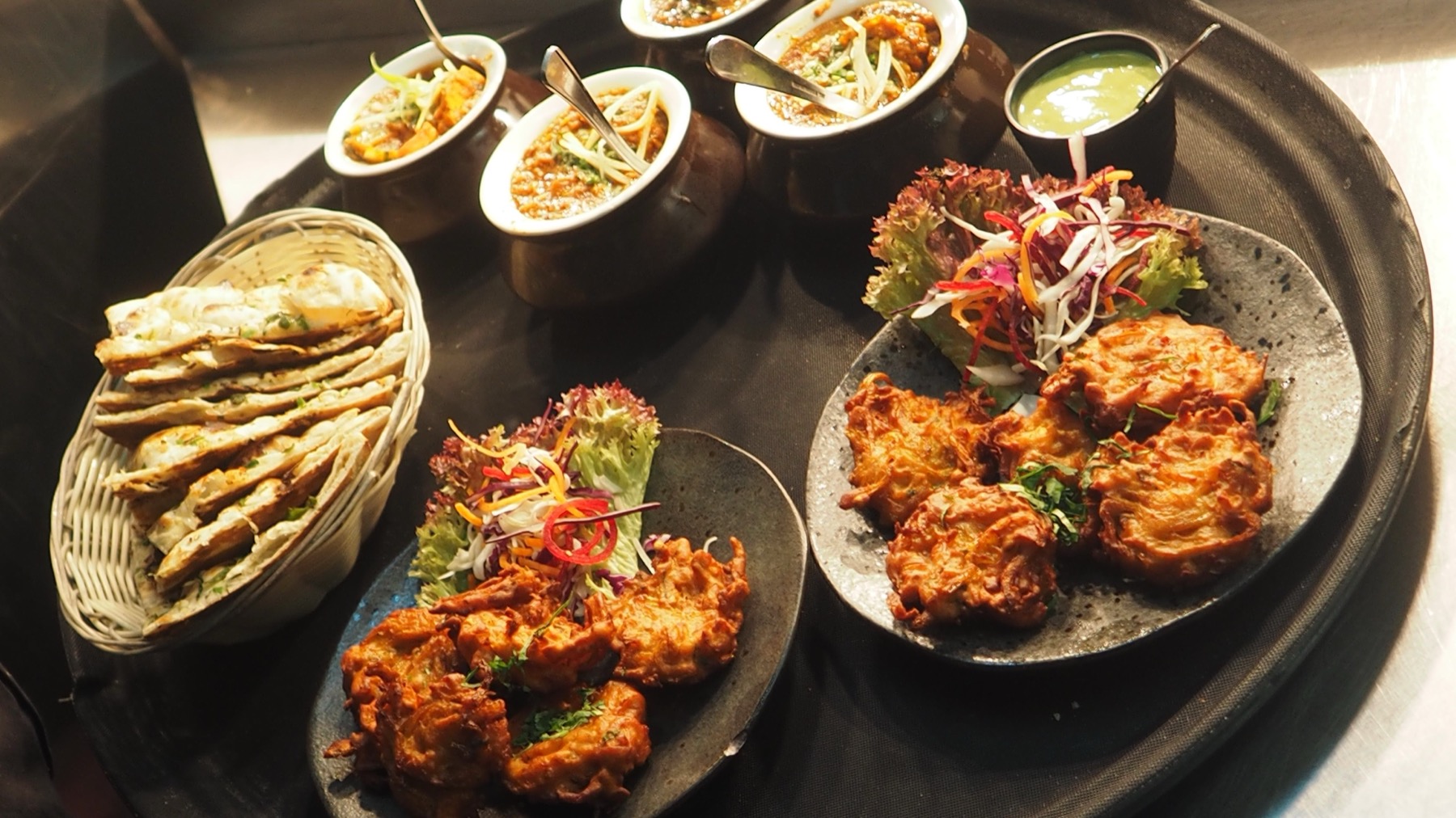 Selection of restaurant food and Indian dishes